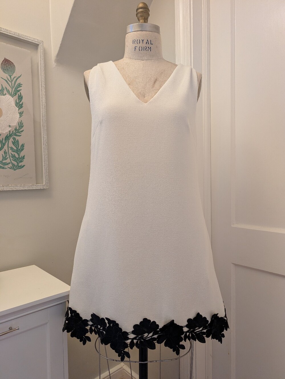 Couture Cream V-Neck Mini Dress with Black Floral Hem